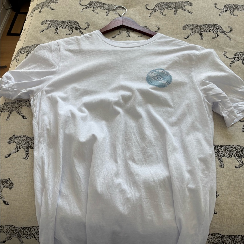 Travis Mathew White Tee with Light Blue Emblem